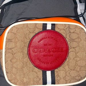 COACH crossbody or side purse. With guitar straps.